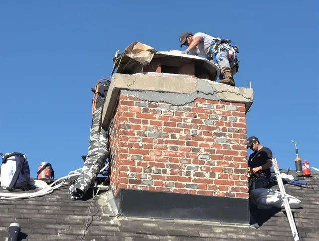 Copley Chimney Sweep installing a custom chimney crown in Copley, OH
